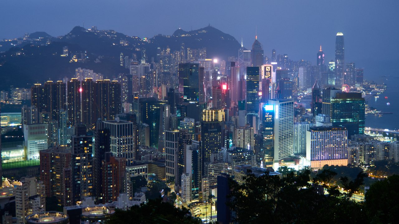 Hong Kong skyline across Victoria Harbour, with the towers of Central and Admiralty